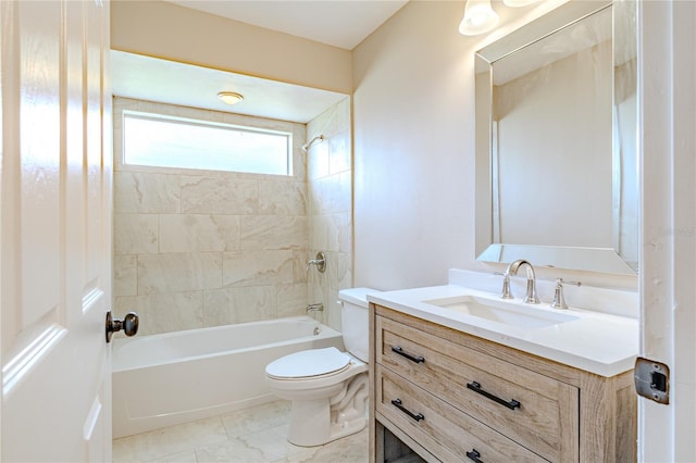 full bathroom with toilet, vanity, and tiled shower / bath combo