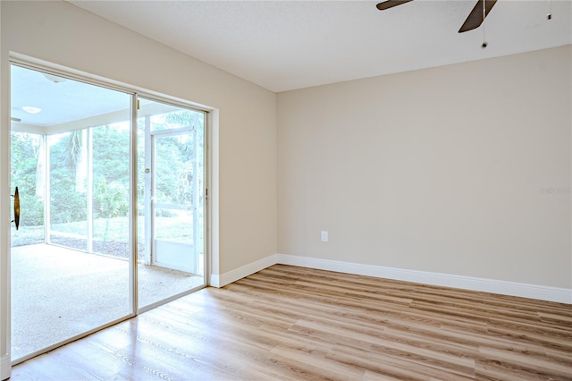 empty room featuring ceiling fan and light hardwood / wood-style floors