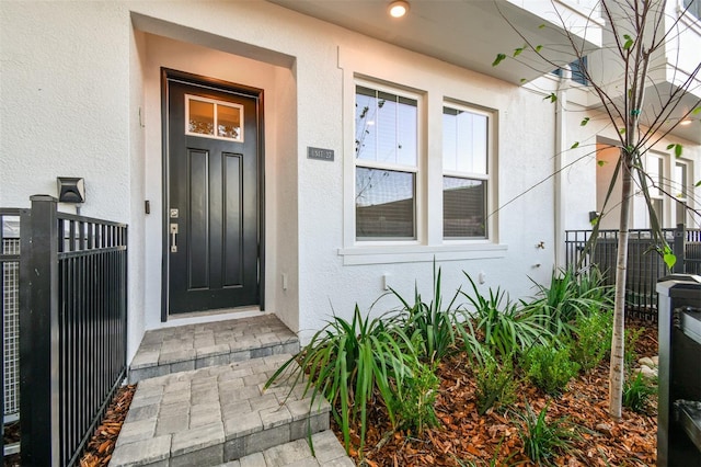 entrance to property featuring cooling unit