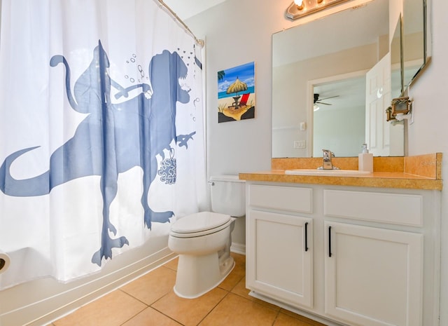 full bathroom featuring tile patterned floors, vanity, toilet, shower / bath combo with shower curtain, and ceiling fan