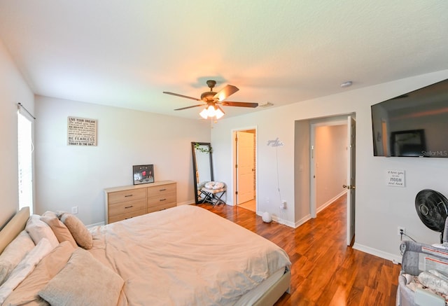 bedroom featuring ceiling fan and dark hardwood / wood-style floors