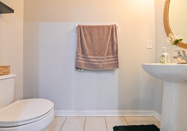 bathroom featuring toilet and tile patterned floors