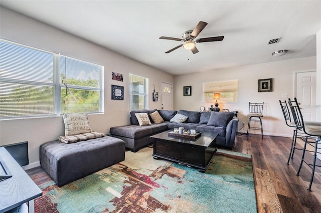 1611 Stevenson Dr, Clearwater, FL 33755 - living room with ceiling fan, wood finished floors, and baseboards