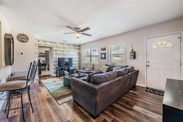 1611 Stevenson Dr, Clearwater, FL 33755 - living area featuring ceiling fan, dark wood-type flooring, and baseboards