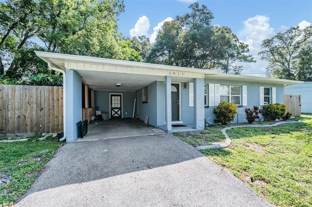 1611 Stevenson Dr, Clearwater, FL 33755 - view of front of home featuring driveway, an attached carport, and stucco siding
