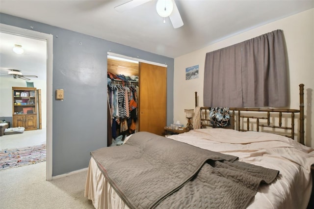 bedroom with ceiling fan, a closet, and light carpet