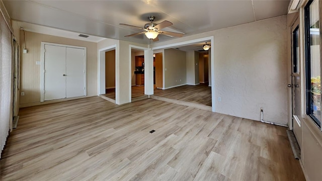 unfurnished bedroom featuring ceiling fan and light hardwood / wood-style flooring