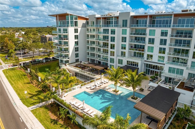 view of building exterior featuring a community pool