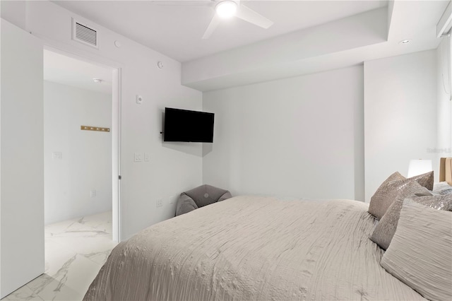 bedroom with ceiling fan and light tile patterned floors