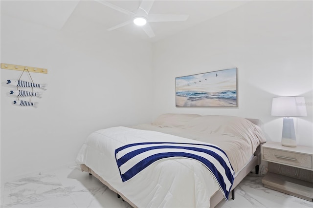 tiled bedroom featuring ceiling fan