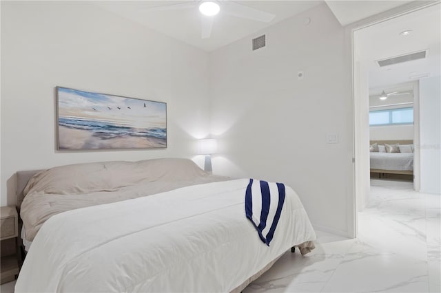 bedroom with ceiling fan and tile patterned floors