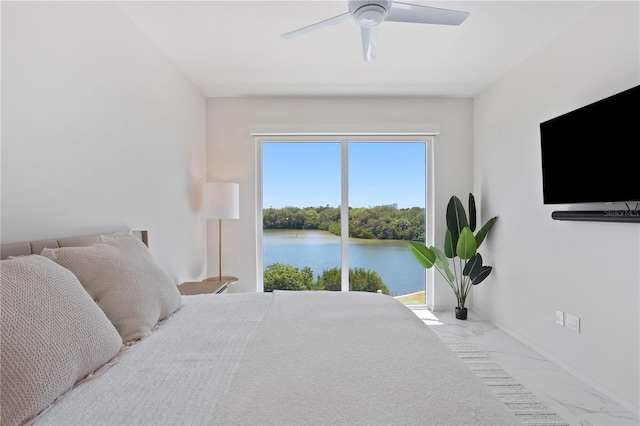 bedroom with ceiling fan, multiple windows, and access to outside