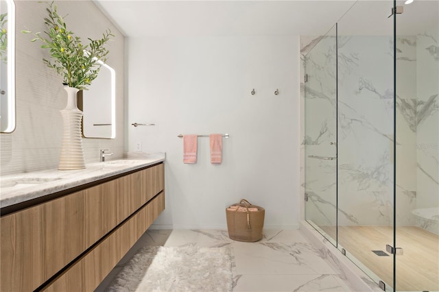 bathroom with tile patterned floors, a shower with door, and vanity