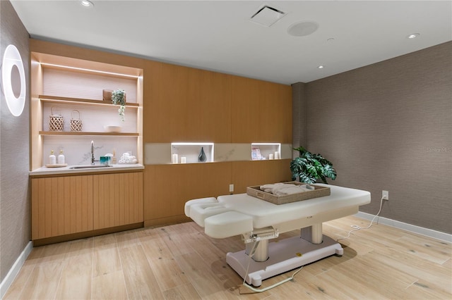 interior space with sink and light wood-type flooring