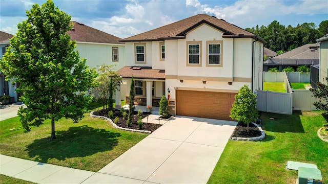 view of front of property with a garage and a front yard