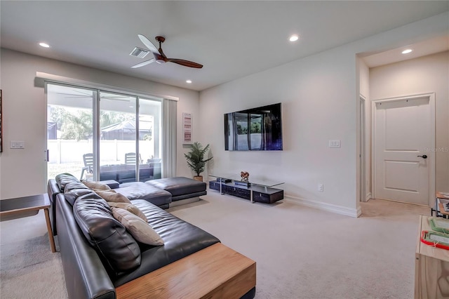 living room with ceiling fan and carpet floors