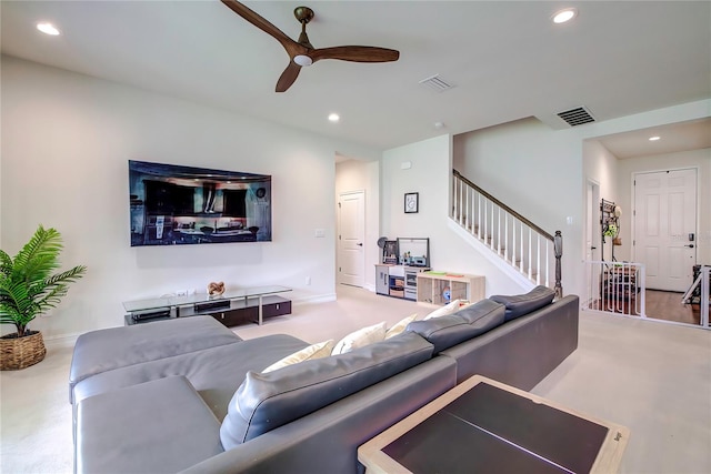 living room with ceiling fan and hardwood / wood-style flooring