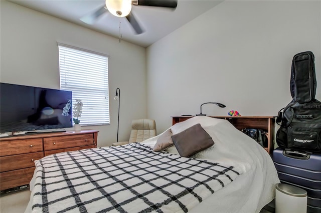 bedroom featuring ceiling fan and vaulted ceiling