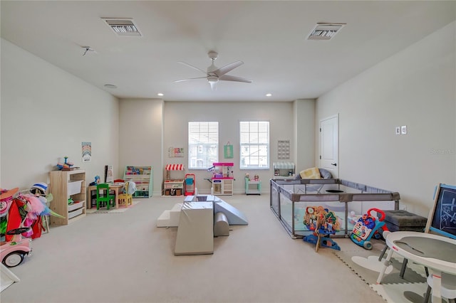 recreation room featuring ceiling fan and carpet floors