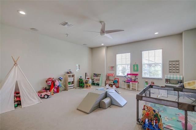 rec room with ceiling fan and carpet flooring