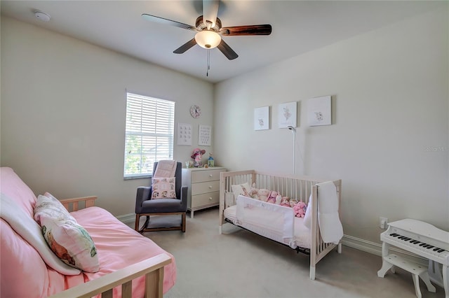 carpeted bedroom with ceiling fan