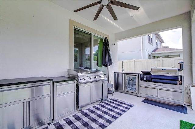 view of patio featuring ceiling fan and exterior kitchen