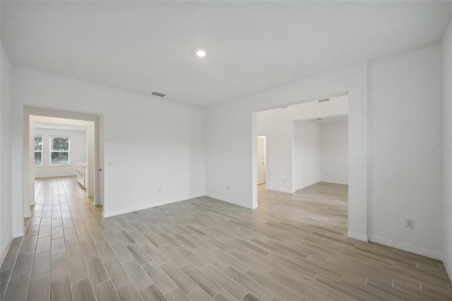 unfurnished room with light hardwood / wood-style floors