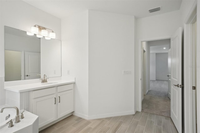 bathroom featuring a bathing tub and vanity