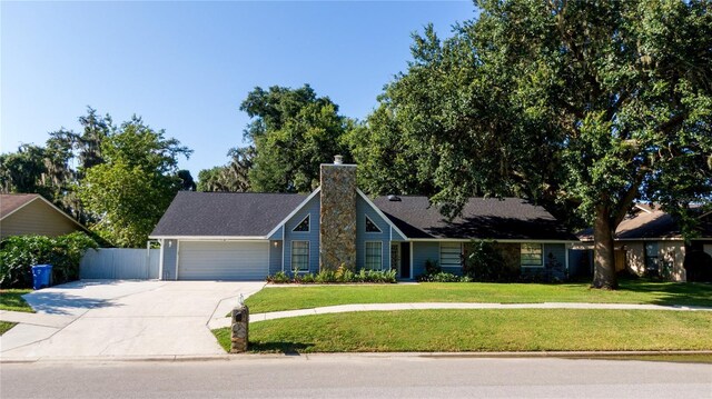 view of front facade with a front yard and a garage