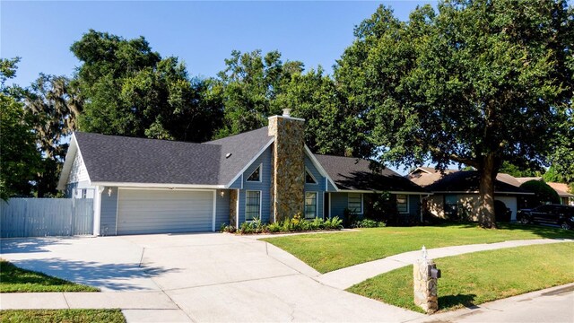 view of front facade featuring a garage and a front lawn