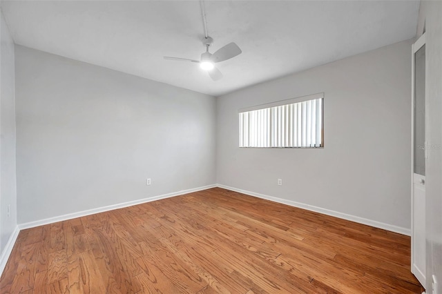 empty room with light hardwood / wood-style flooring and ceiling fan