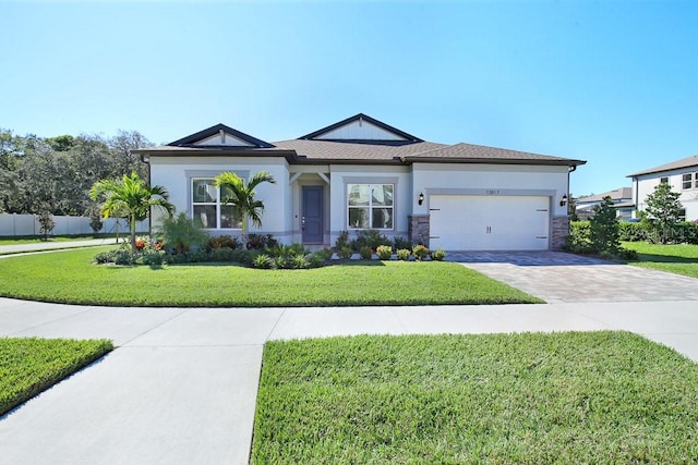 view of front of home with a garage and a front yard