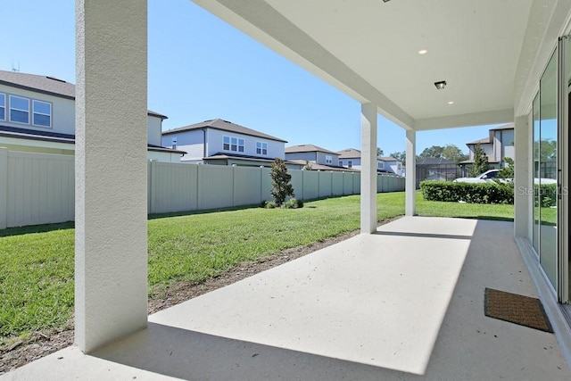 view of patio featuring a residential view and a fenced backyard