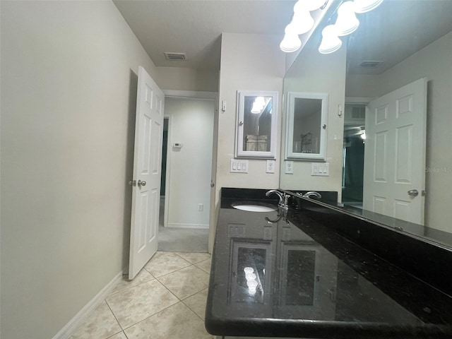 bathroom with tile patterned floors and vanity