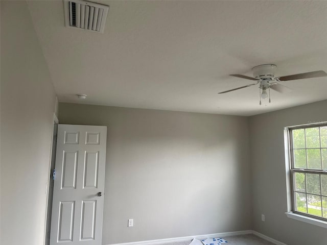 unfurnished room with ceiling fan