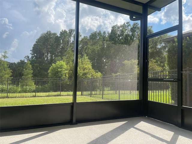 unfurnished sunroom featuring plenty of natural light