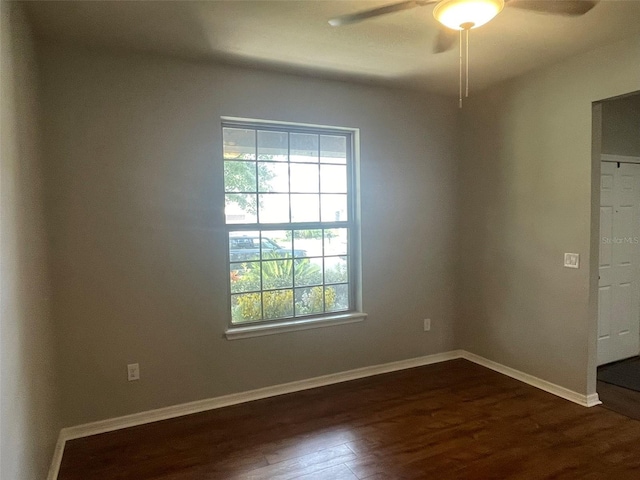 empty room featuring dark hardwood / wood-style floors and ceiling fan