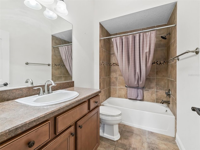 full bath with toilet, shower / bath combo, vanity, and tile patterned floors