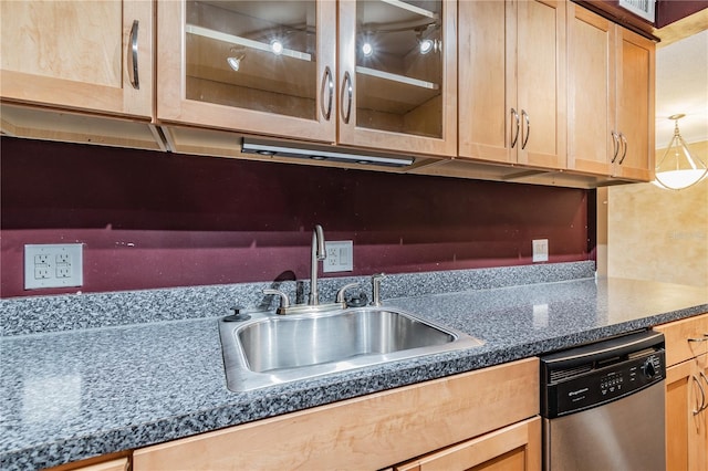 kitchen featuring sink, dishwasher, decorative light fixtures, and light brown cabinets