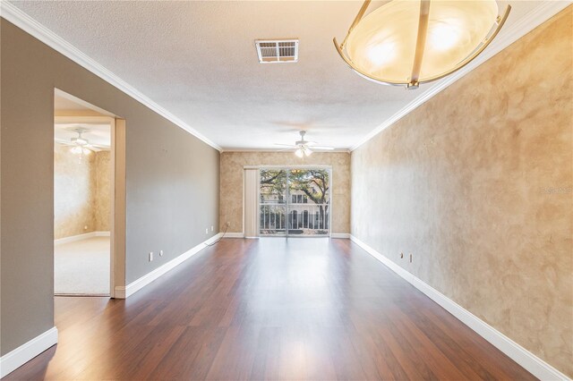 empty room with ceiling fan, hardwood / wood-style flooring, and a textured ceiling