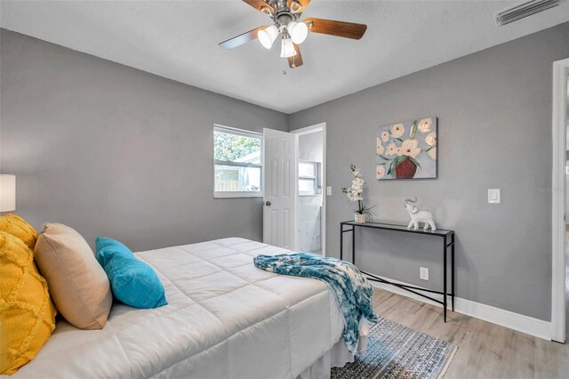 bedroom featuring light hardwood / wood-style floors and ceiling fan