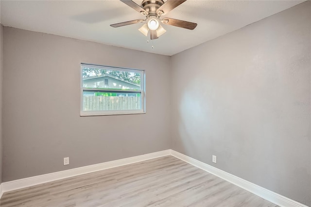 spare room featuring ceiling fan and light wood-type flooring