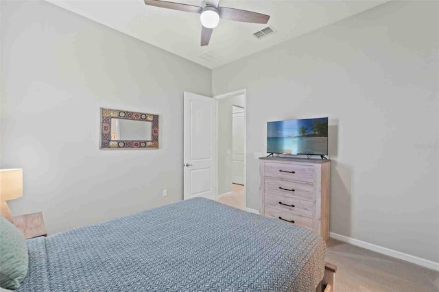 bedroom with light colored carpet and ceiling fan