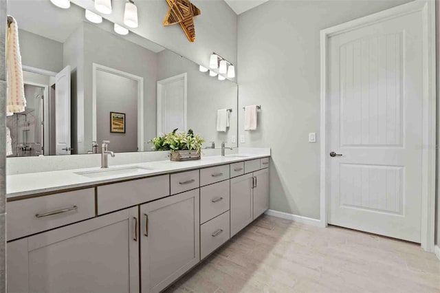 bathroom with vanity and wood-type flooring