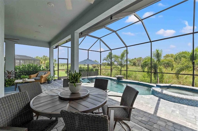 exterior space with a lanai, an outdoor hangout area, and a pool with hot tub