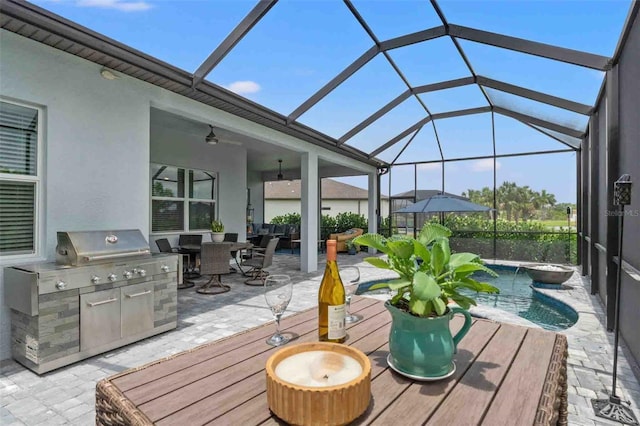 view of patio featuring pool water feature, area for grilling, and glass enclosure