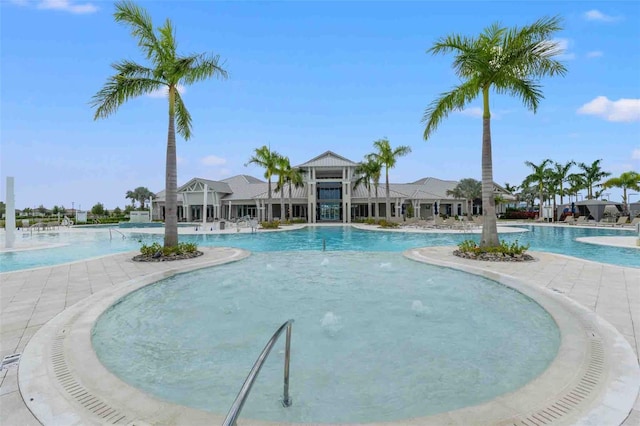 view of pool with pool water feature