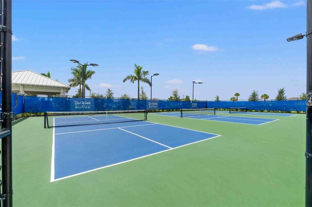 view of tennis court with basketball court