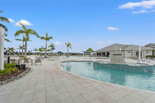 view of swimming pool with a patio area