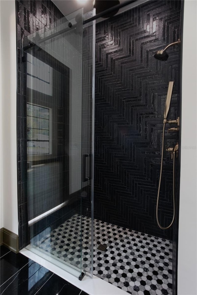 bathroom with a shower stall